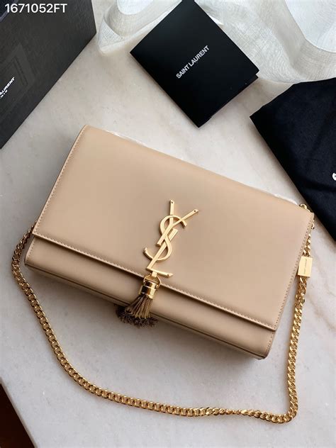 ysl monogram tassel clutch|ysl monogram clutch dark beige.